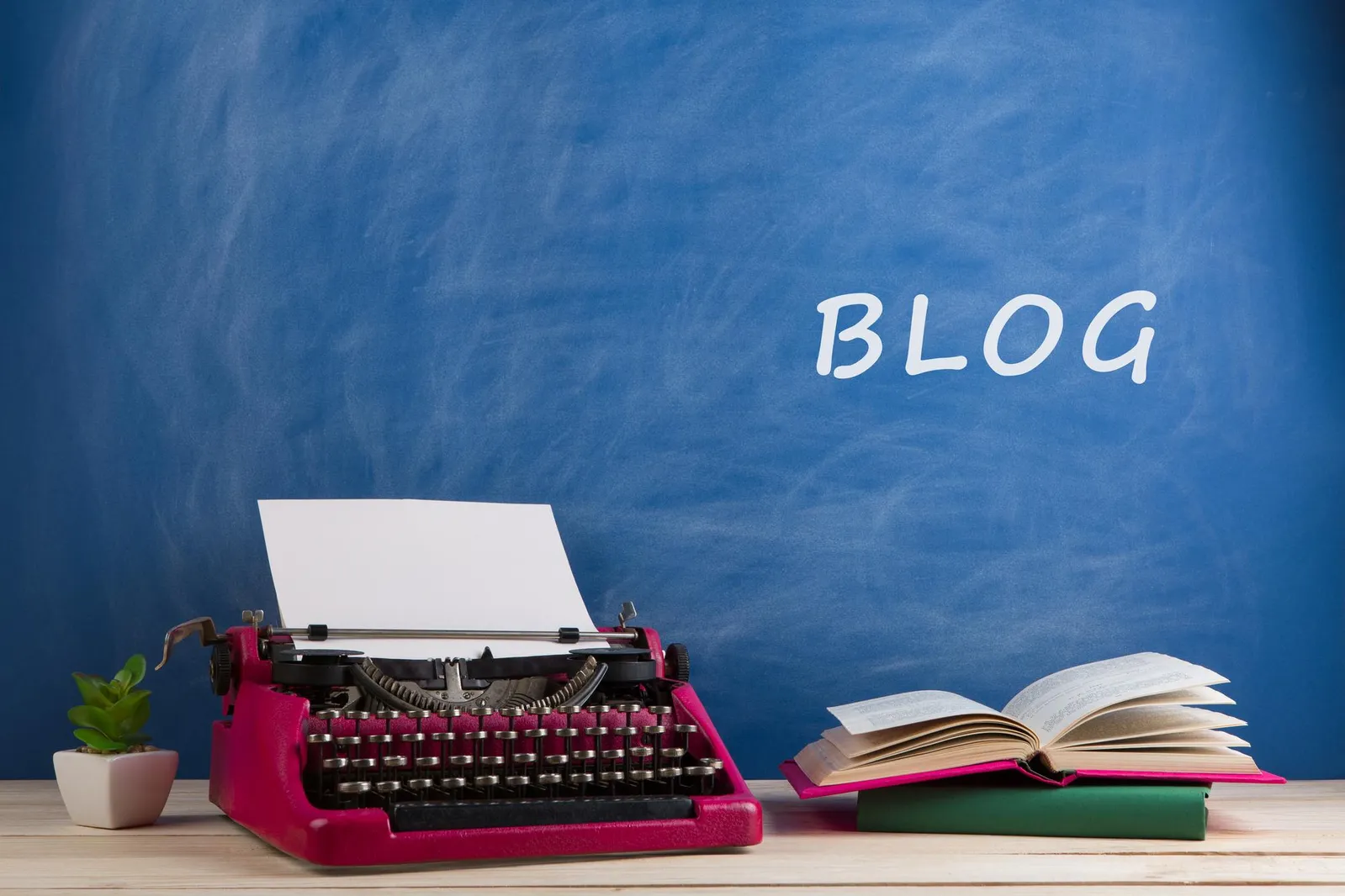 A typewriter and books representing thoughtful learning